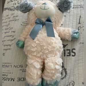White dog with blue accessories